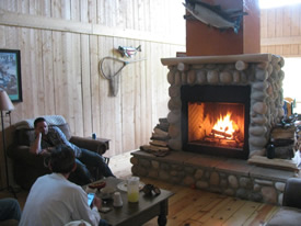 Share the day's fishing stories around our cozy stone fireplace.
